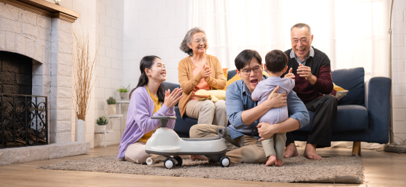 family of 5 playing on a couch
