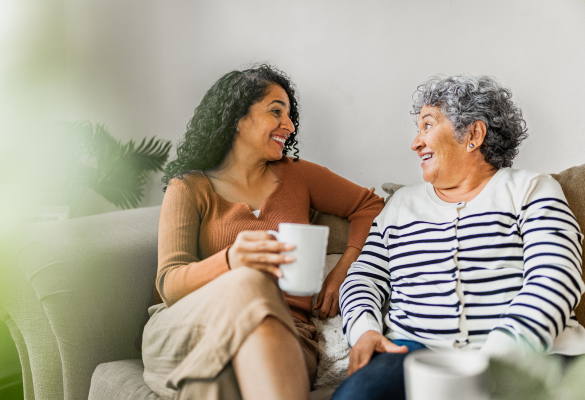 Two women sitting on a couch