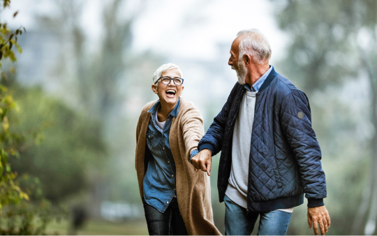 elderly couple hiking in nature