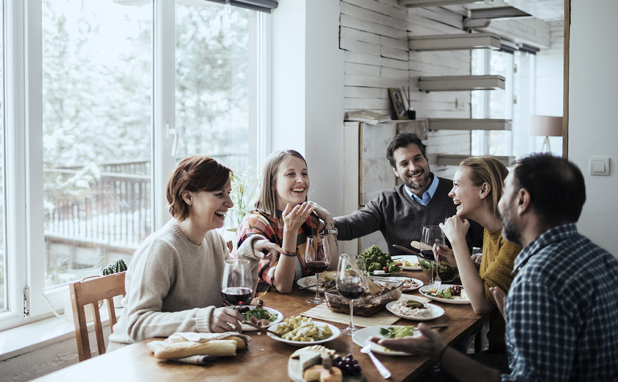 family of 5 eating around a table